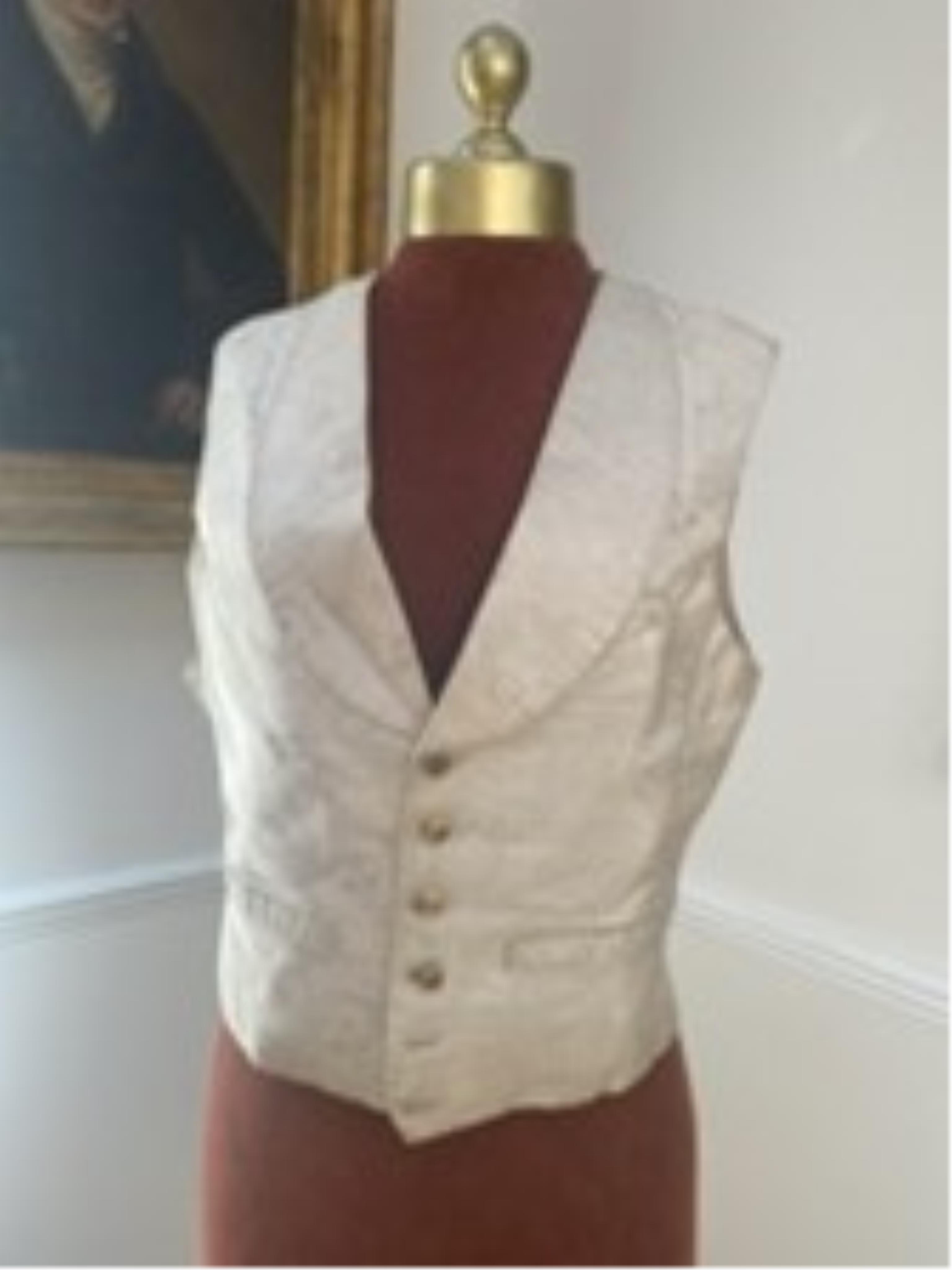 Four silk and brocade waistcoats (one red and three white/cream)